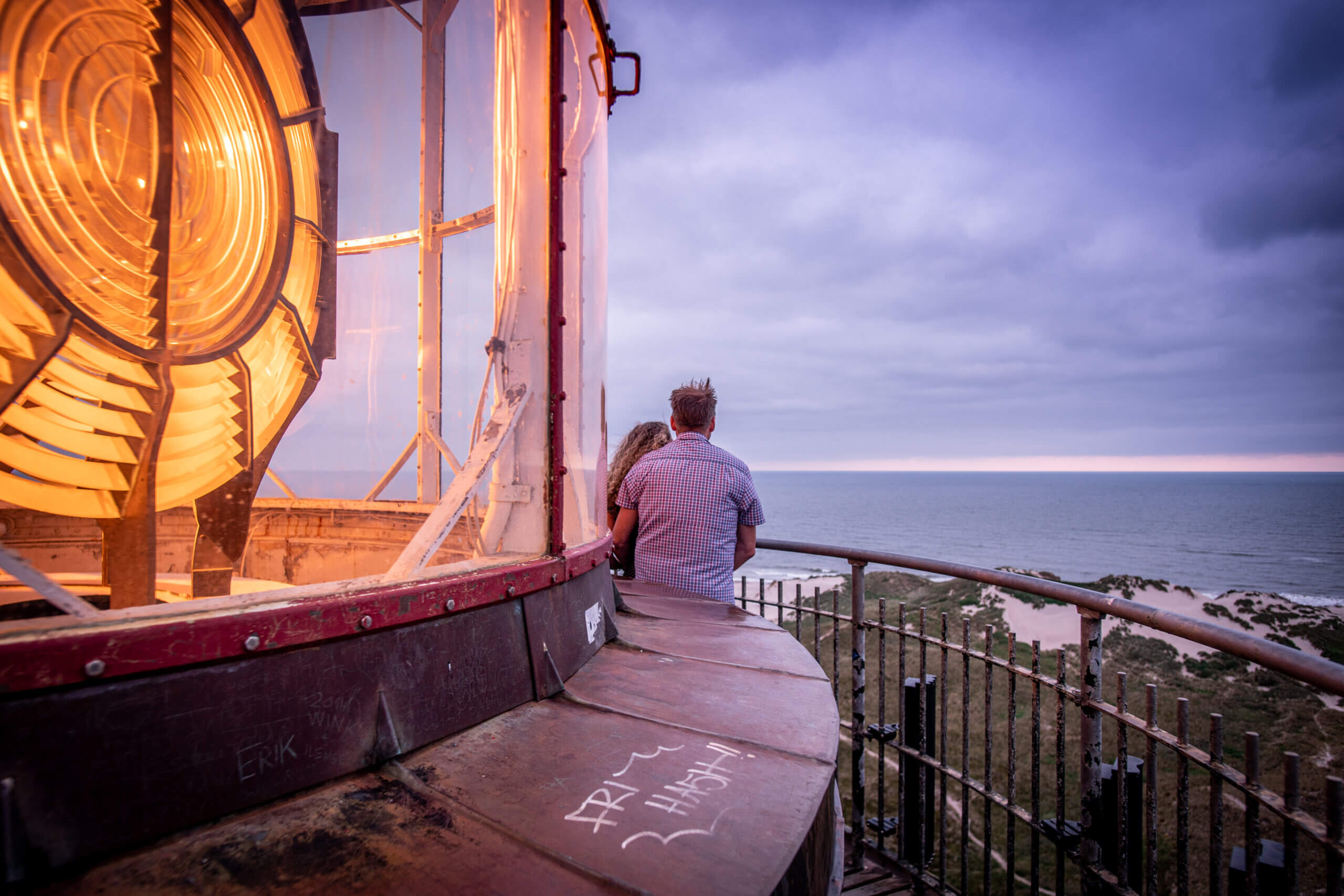 A couple enjoying the sunset from the top of Lyngvig Fyr on the Fourth of July.